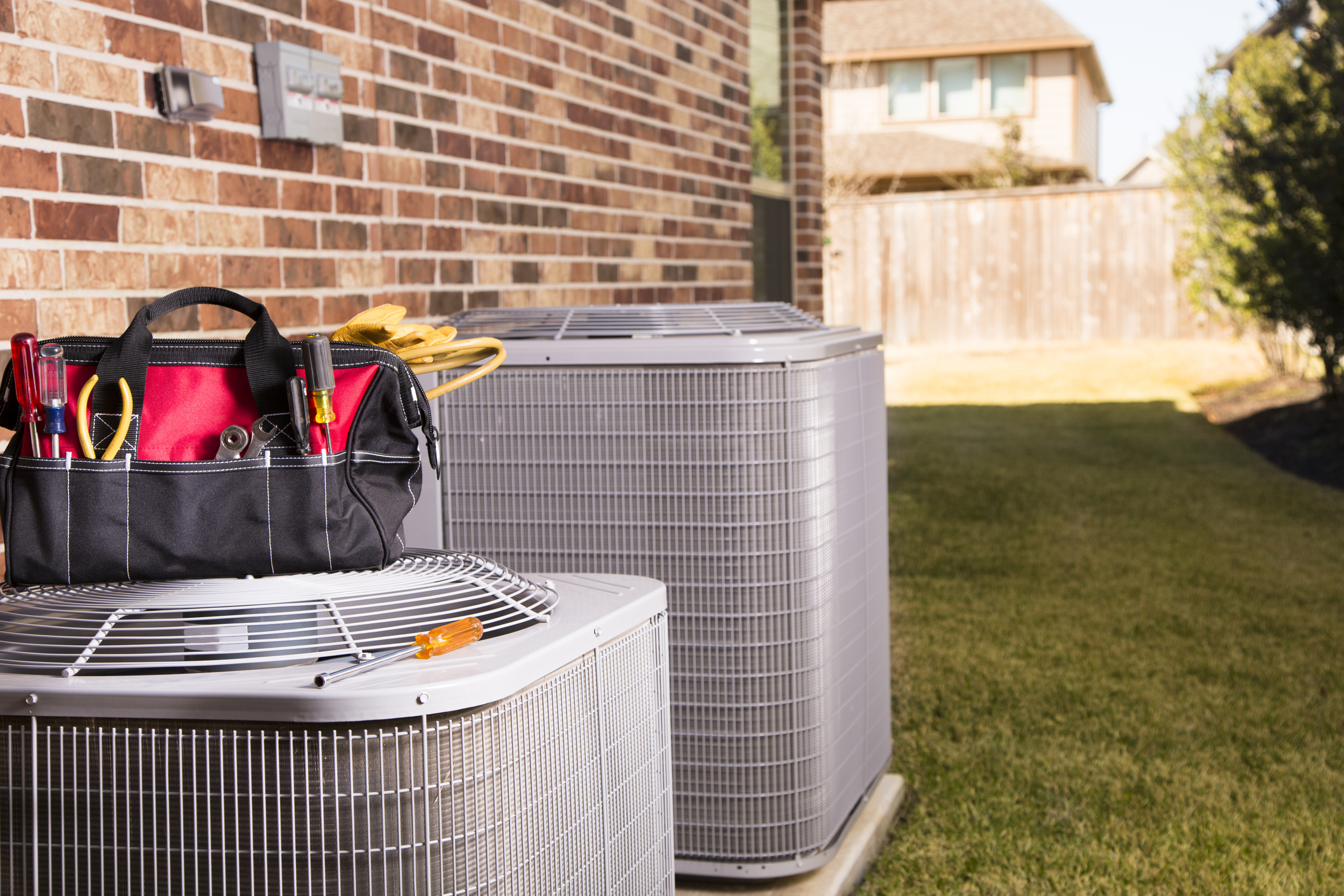 Air conditioner repair on outdoor condenser unit