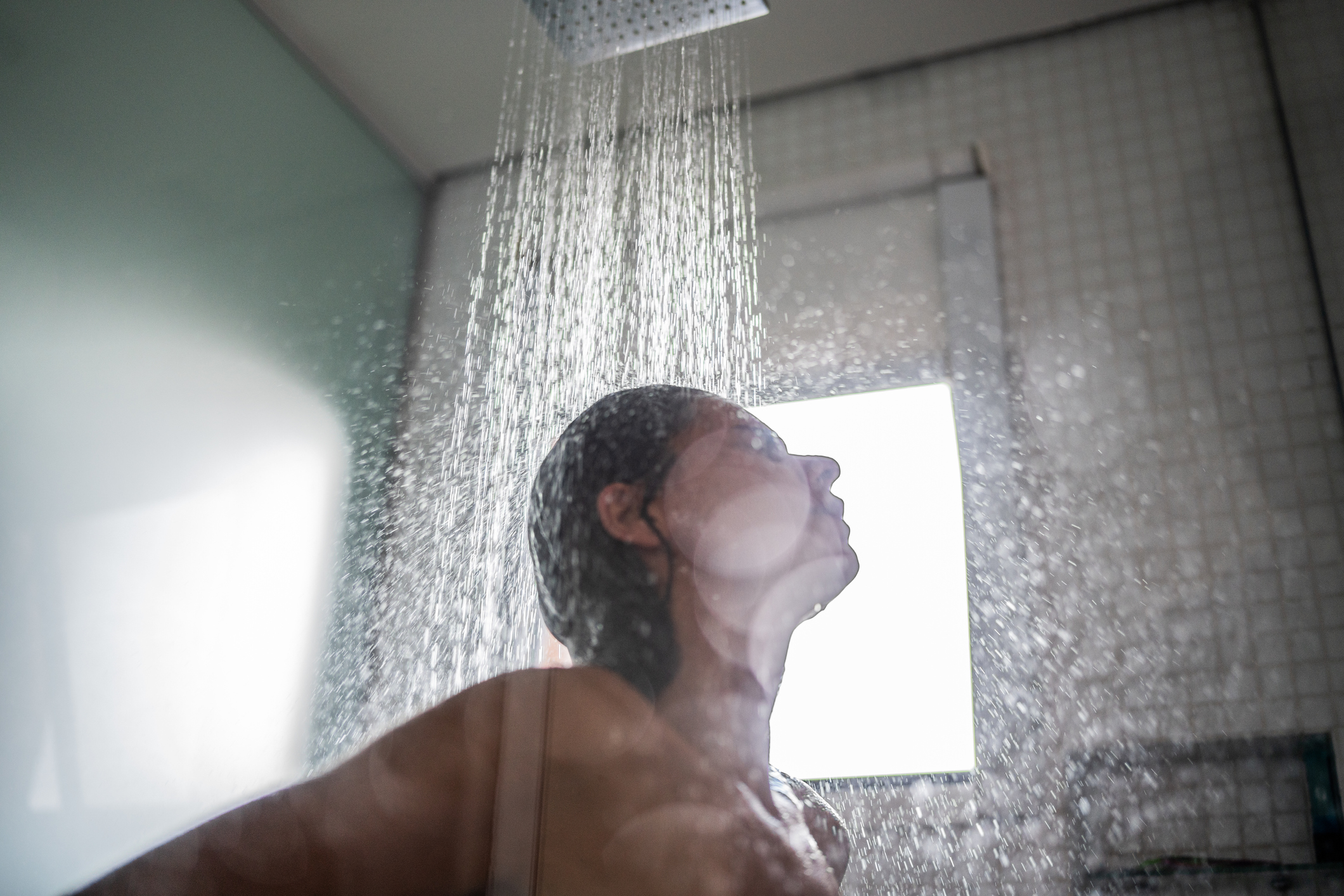 Woman taking a hot shower